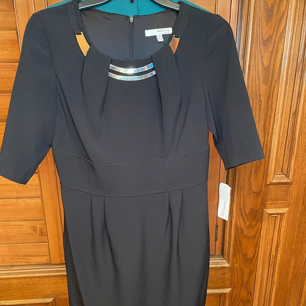 Studio one black dress with attached gold necklace accent